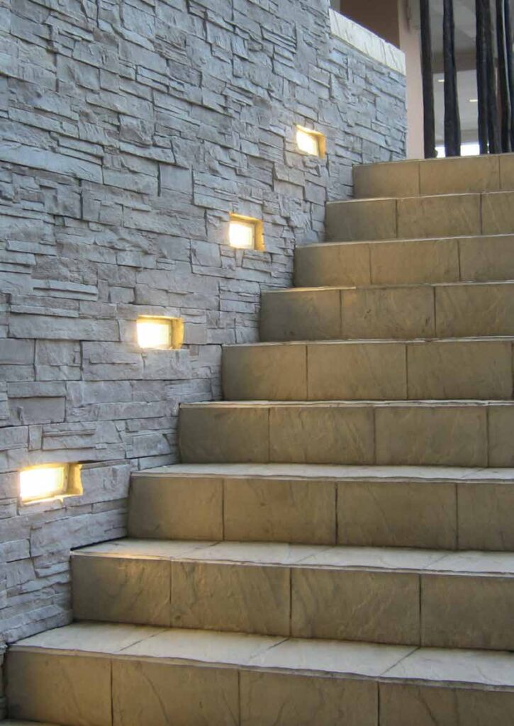 Step Light: The neatly designed modern and minimal step light melds into the background settings and provides just the right ambient illumination to create an interesting setting.